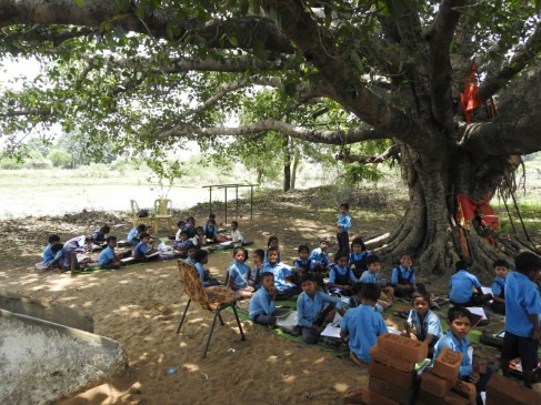 Class looking under the tree due to School Building shabby in mandla