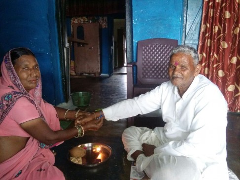 Muslim sister tie rakhi hindu brother wrist