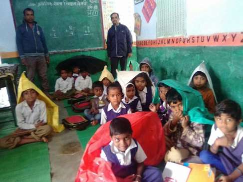 Students sitting on polythene muffle in school