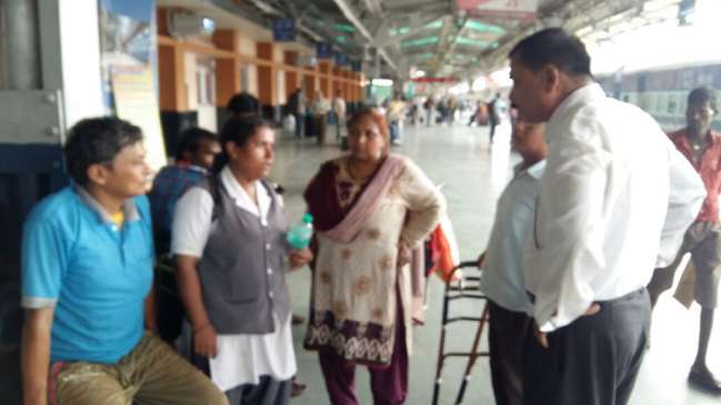 girl wander for wheelchair in railway station