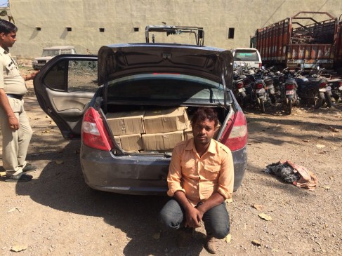 Police caught 26 cartridges of wine bottel , driver arrested