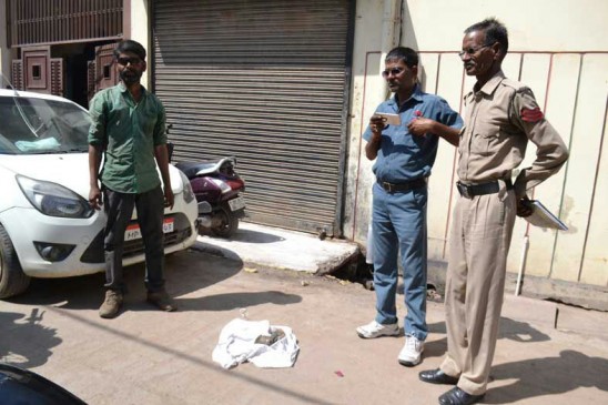 The body of a newborn was moving around in the jaw of street Dog