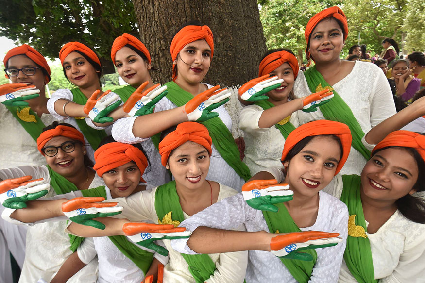 Image of Girls with her face and hand painted in Tricolor poses for  photographs on the eve of 72nd Republic Day, in Jammu, Monday, Jan. 25,  2021.-GO504212-Picxy