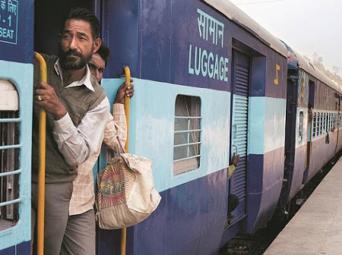 Migrant laborers returning from village in search of employment