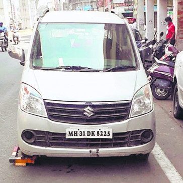 Car driver moves from no parking to traffic police jammer