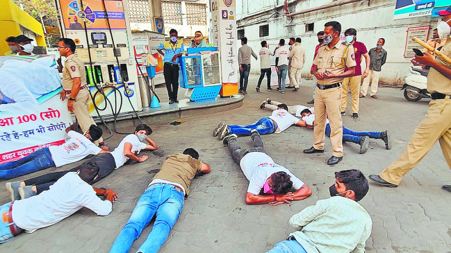 Protest against rising prices by sleeping at petrol pump