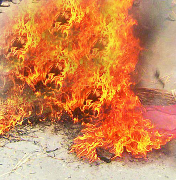 Two-wheeler standing in front of the house was set on fire