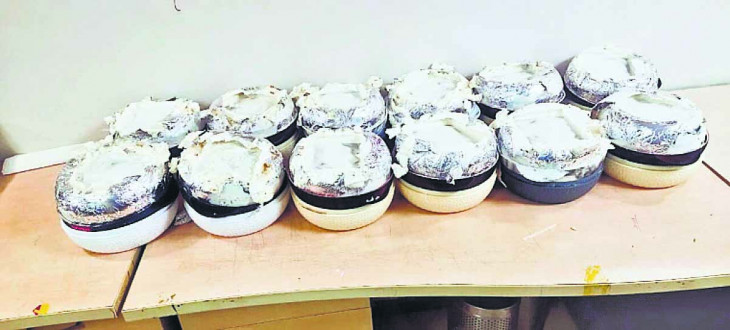 Hearing in court, weight of drugs included in weight of paper?