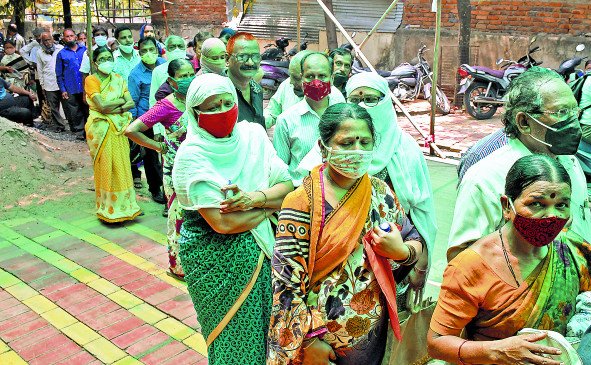 Huge crowd of people taking vaccine in medical, getting vaccine on second day