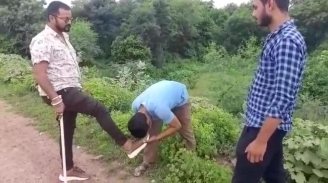 The bullies beat up the businessman by kidnapping him, forced him to lick by spitting on the ground