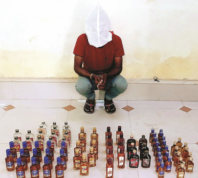 Country liquor seized including two accused, caught selling illegal liquor from home