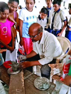 The art of making clay Ganpati being taught to the students The art of making clay Ganpati being taught to the students